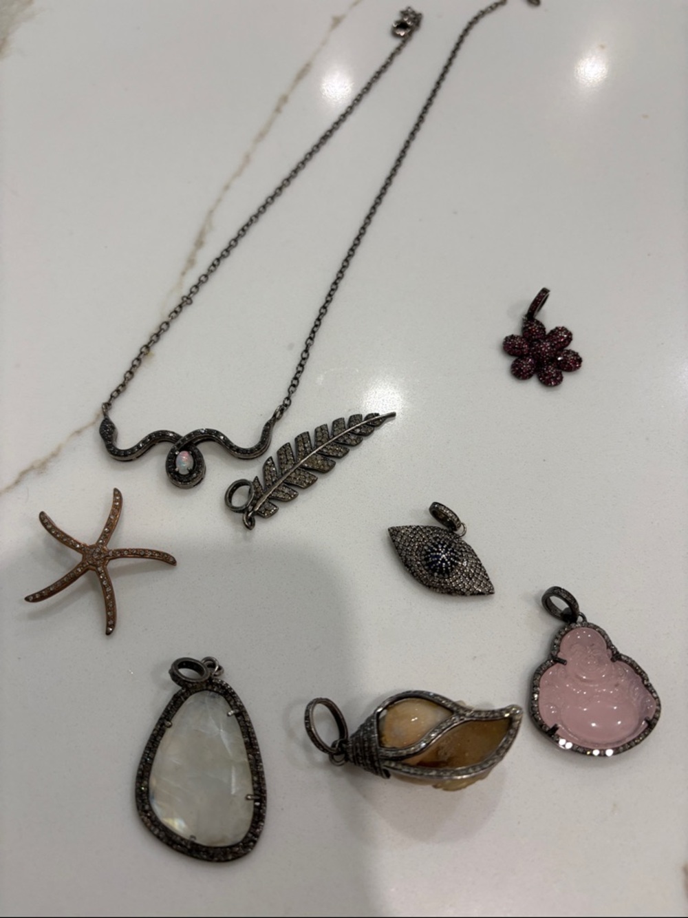Bundle of charms with real stones and necklace.